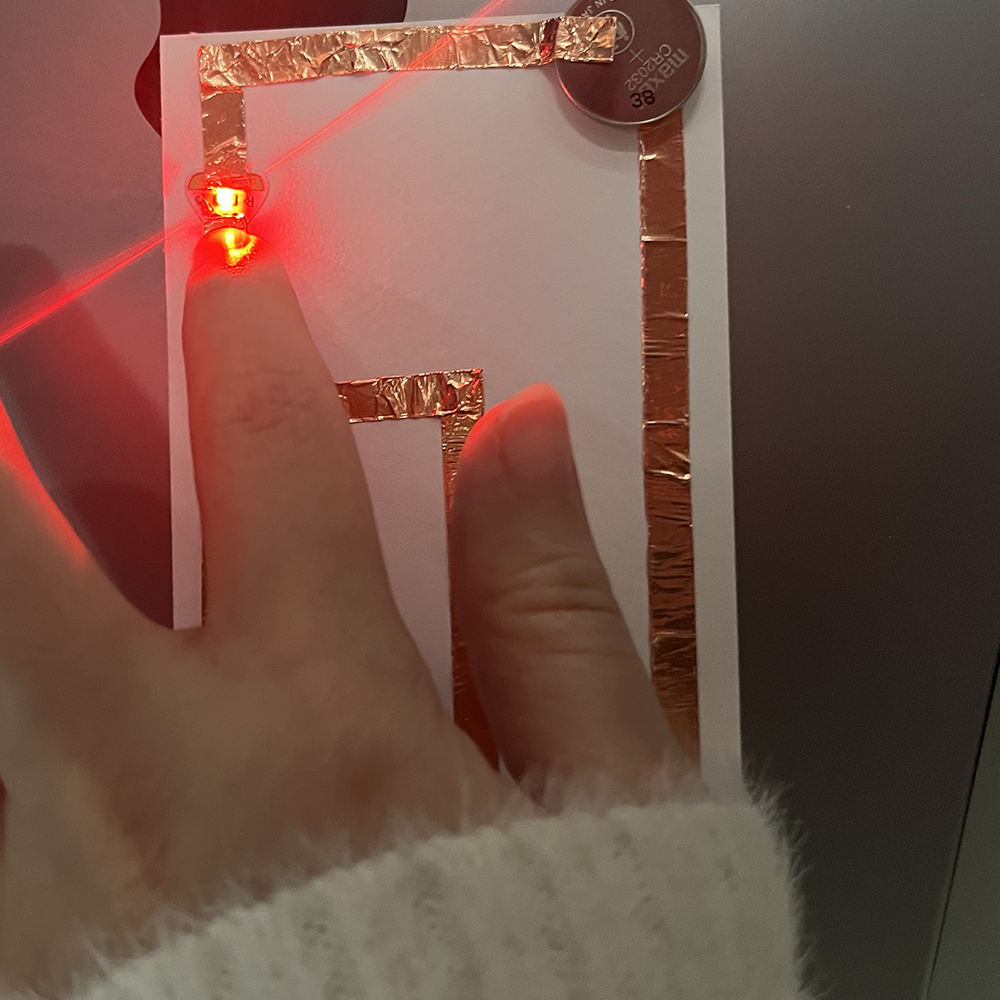 Making test of low voltage electricity through complex pathway using copper tap and light working.